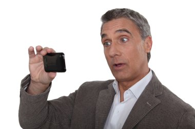 Man taking photo on mobile telephone clipart