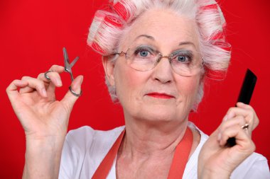 Grandmother with scissors and haircurlers clipart
