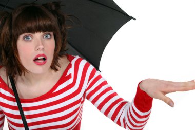 Shocked woman under an umbrella clipart