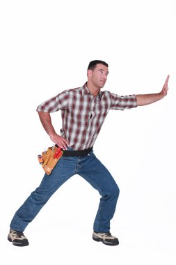 Construction worker miming. clipart