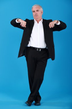 Grey-haired businessman lifting arms clipart