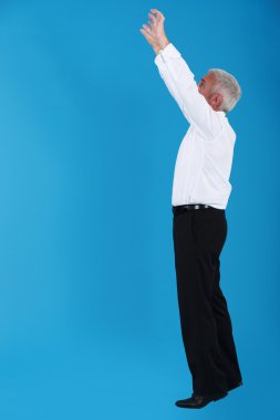 Man stretching to reach an object clipart
