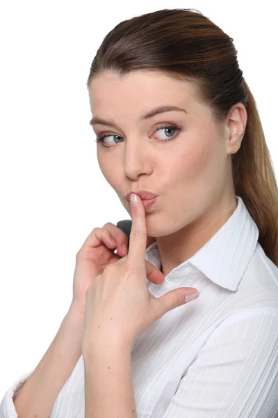 Retrato de una mujer de negocios descarada con el dedo en los labios —  Fotos de Stock