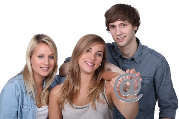 Three friends holding at symbol — Stock Photo, Image