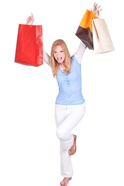 Mulher excitada pulando com sacos de compras — Fotografia de Stock