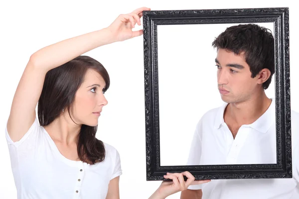 Boy and girl with black frame — Stock Photo, Image