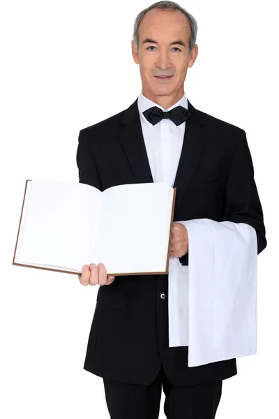 Um empregado com um livro em branco — Fotografia de Stock