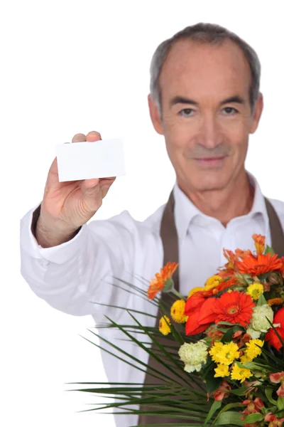 Florist showing business card — Stock Photo, Image