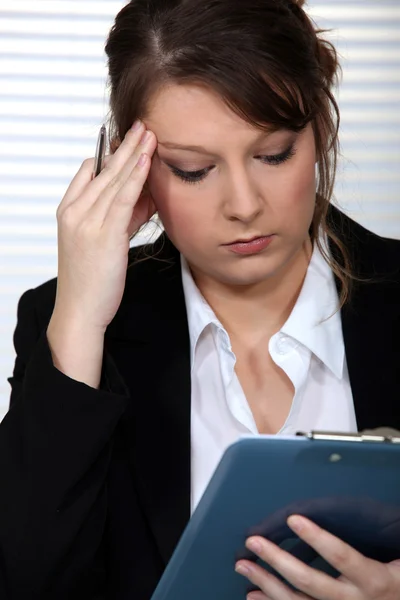 A businesswoman having a headache. — Stock Photo, Image