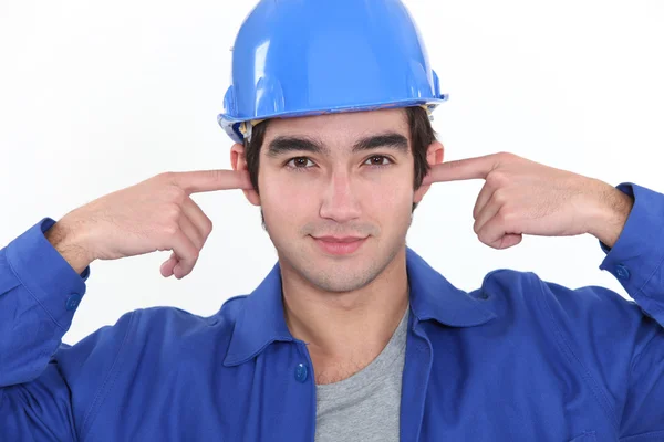 Craftsman plugging his ears — Stock Photo, Image