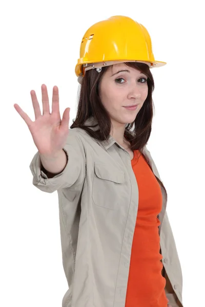 A female construction worker doing a stop sign. — Stock Photo, Image