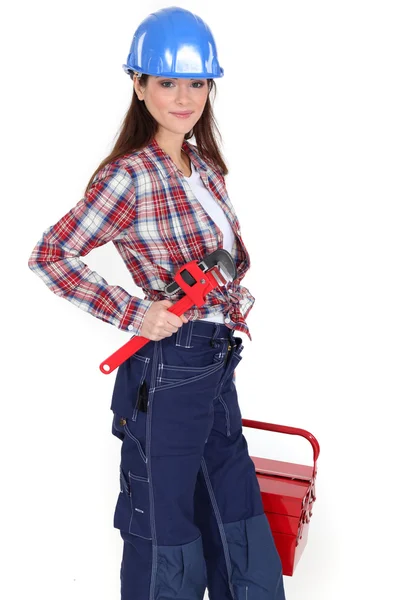 Vrouwelijke werknemer met een toolbox — Stockfoto
