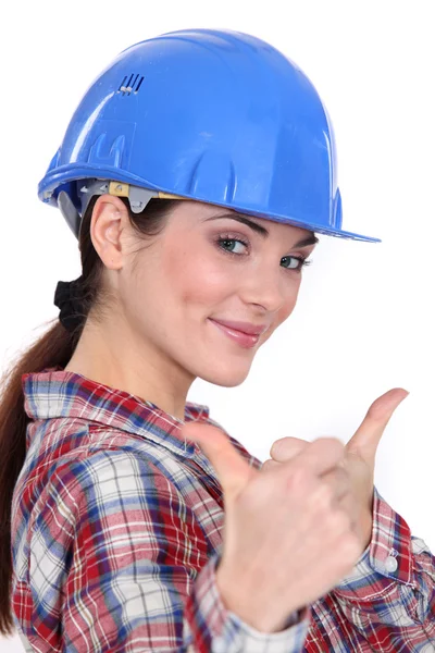 Iki başparmak yukarıya ile bir kadın inşaat işçisi. — Stok fotoğraf