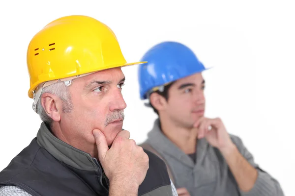 Thoughtful construction workers — Stock Photo, Image