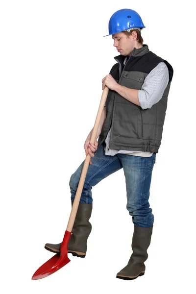 Tradesman using a spade — Stok fotoğraf