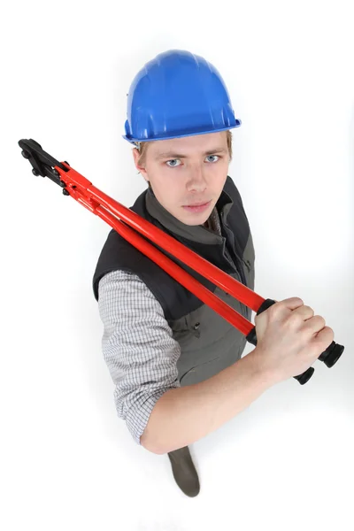 Menacing tradesman holding large clippers — Stock Photo, Image