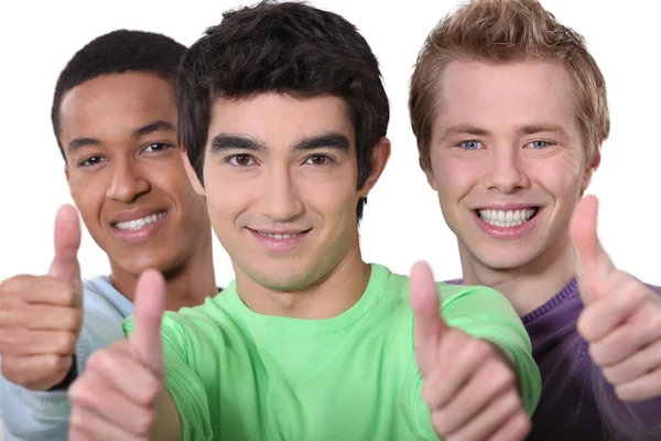 Drie mannen geven thumbs-up teken — Stockfoto