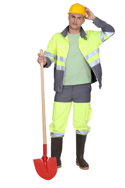 Trabajador de la construcción con una pala — Foto de Stock