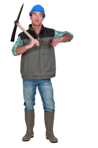 Annoyed man holding axe — Stock Photo, Image