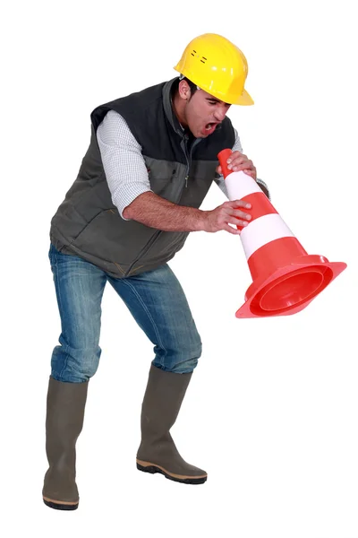 stock image Frustrated builder shouting into traffic cone