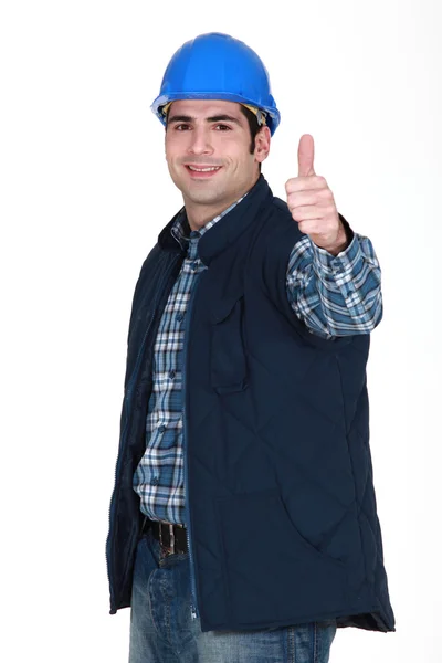 Portret van jonge ambachtsman duim omhoog — Stockfoto