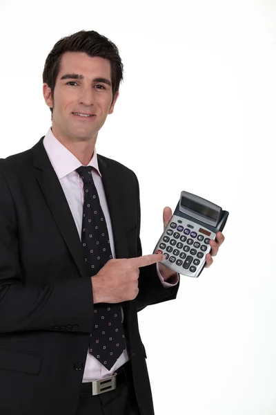Uomo d'affari con una calcolatrice — Foto Stock
