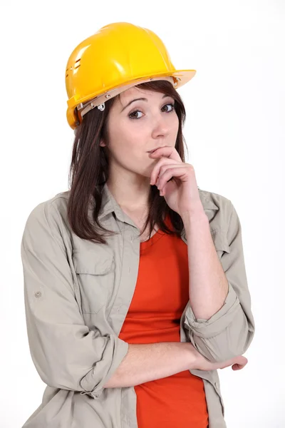 Thoughtful female apprentice Royalty Free Stock Images