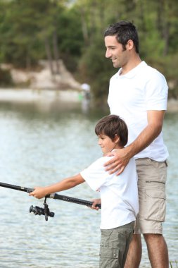 Father and son fishing clipart