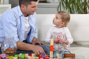 Father playing with daughter clipart