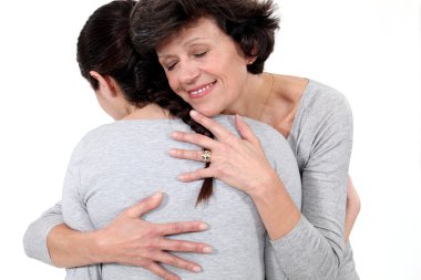 Woman hugging her mother clipart