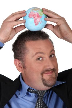 Businessman with a globe on his head clipart