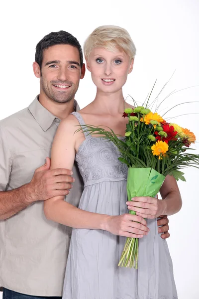 Couple with flowers — Stock Photo, Image