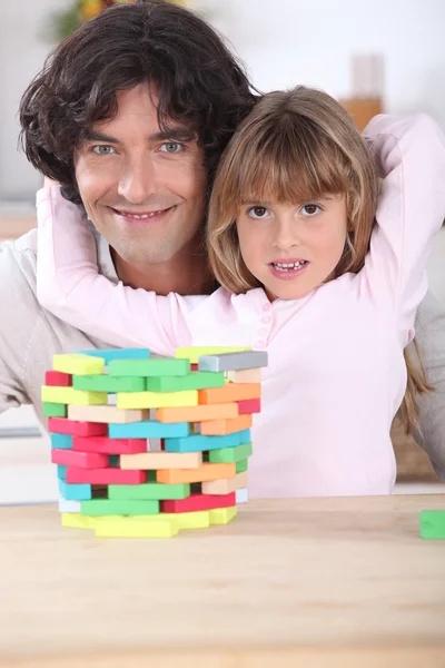 Pai com filha e quebra-cabeça — Fotografia de Stock