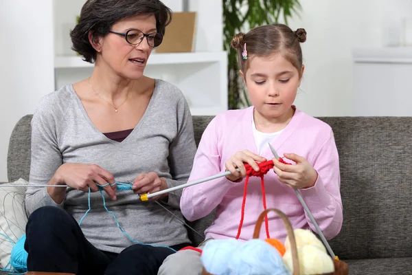 Grandmother with granddaughter knitting — Stock Photo, Image