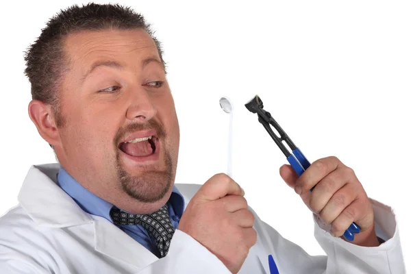 stock image Man preparing to pull out his own tooth