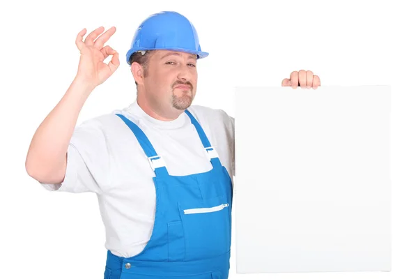 Lavoratore con cartello bianco — Foto Stock