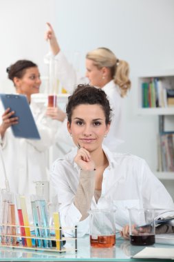 Young women conducting experiments clipart