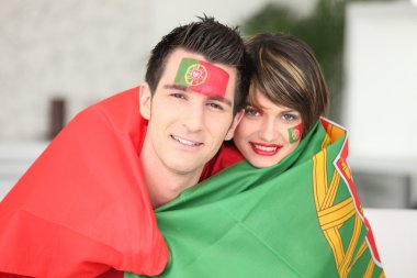 Portuguese soccer fans wrapped in flag clipart