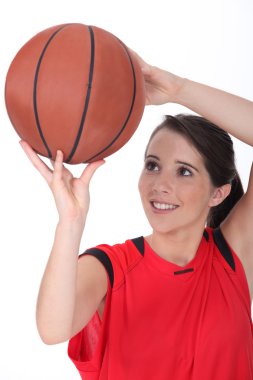 Young female basketball player clipart