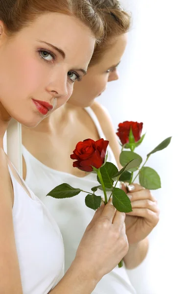 Woman with a rose in hand — Stock Photo, Image