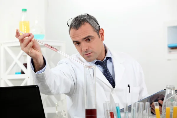 Biologist with test tubes — Stock Photo, Image