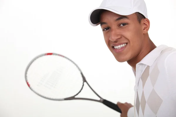 打网球的穿衣服的年轻男子 — 图库照片