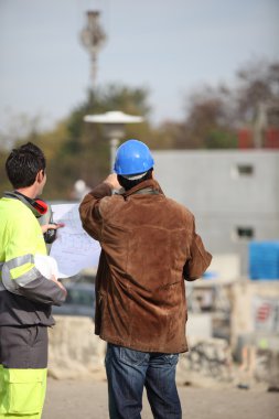 Men on a construction site clipart