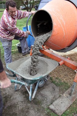 Man with a cement mixer clipart