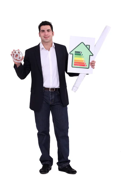Man with sign and energy panel — Stock Photo, Image