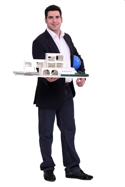 Arquiteto com um modelo de escala — Fotografia de Stock