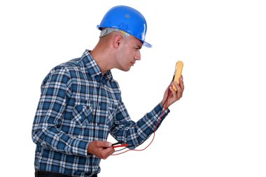 Worker with a voltmeter clipart