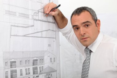 An architect drawing a plan clipart