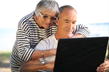 Couple of seniors outdoors clipart