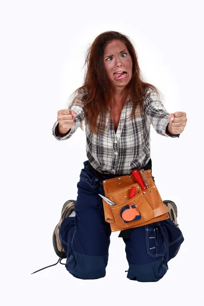 A handywoman who took an electrical shock. — Stock Photo, Image